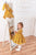 Meiteņu kleita sinepju krāsā ''Barbara''  kokvilnas auduma un dekorēta ar mežģīnēm
